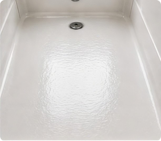 Untreated shower floor before anti-slip coating application